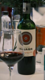 Elegant Sanama Cabernet Sauvignon Wine Bottle and Glass Wallpaper