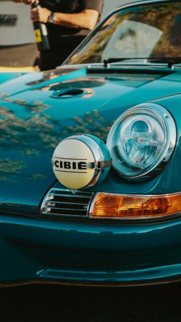 Teal Classic Porsche 911 with Cibie Rally Light Mobile Wallpaper