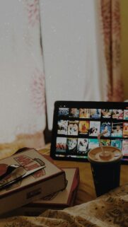 Cozy Movie Night Setup with Papa Johns and Netflix Wallpaper