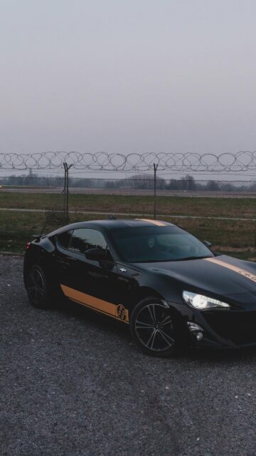 Black Toyota 86 JDM Sports Car with Gold Racing Stripes Wallpaper
