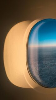 Stunning Airplane Window View Over Snowy Landscape Mobile Wallpaper