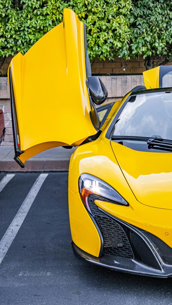 Stunning Yellow McLaren 650S Supercar with Open Dihedral Doors Wallpaper