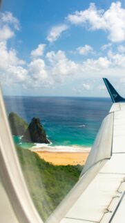 Stunning Aerial View of Tropical Island Coastline Plane Wing Wallpaper