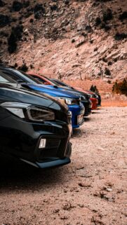 Subaru WRX Lineup Parked on Desert Road Mobile Wallpaper