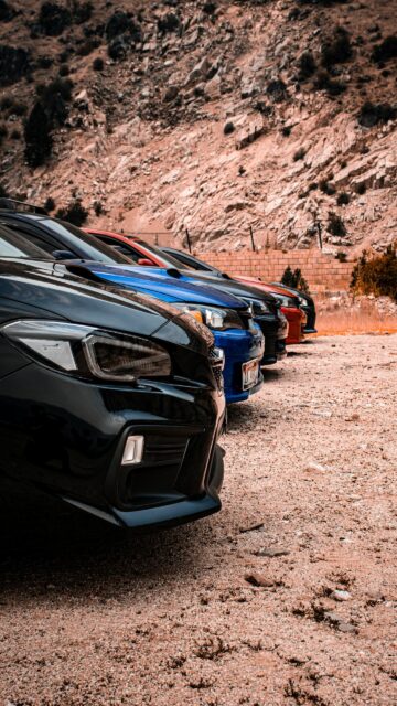 Subaru WRX Lineup Parked on Desert Road Mobile Wallpaper