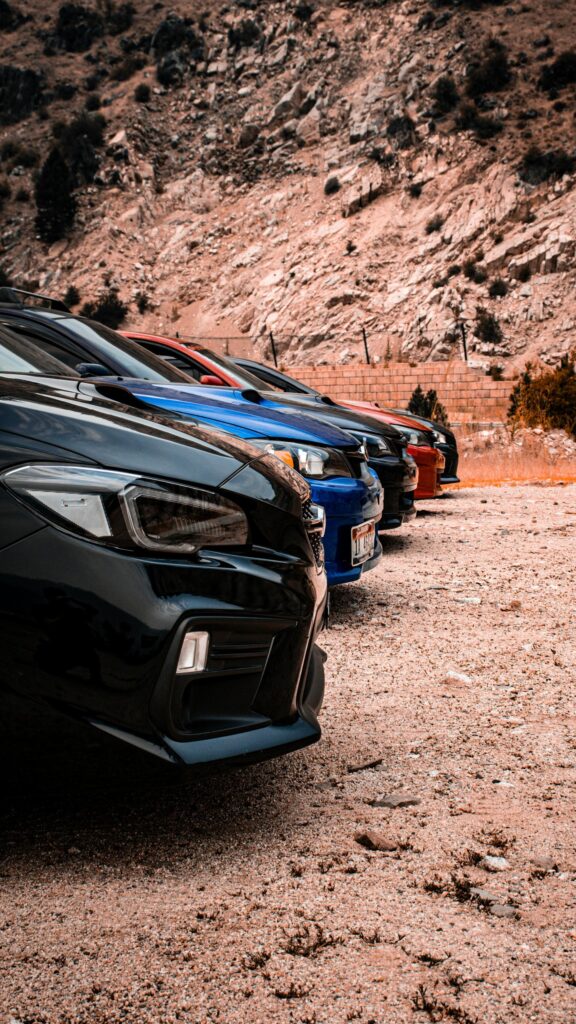 Subaru WRX Lineup Parked on Desert Road Mobile Wallpaper