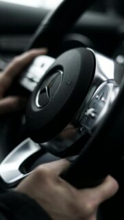 Close-up of a Luxury Mercedes-Benz Steering Wheel Interior Wallpaper