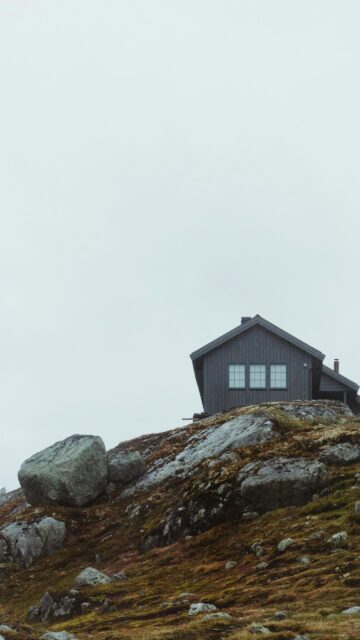 Moody Nordic Cabin on a Rocky Hill Minimalist Mobile Wallpaper