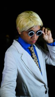 Stylish Man in White Blazer and Round Glasses Cosplay Portrait Wallpaper