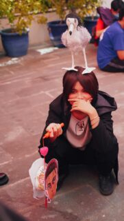Anime Cosplay Girl with Bird Hat and Eren Yeager Prop Wallpaper