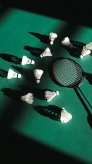 Dynamic Badminton Racket and Shuttlecocks Green Aesthetic Wallpaper
