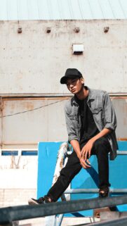 Young Man in Denim Shirt and Cap Urban Style Mobile Wallpaper