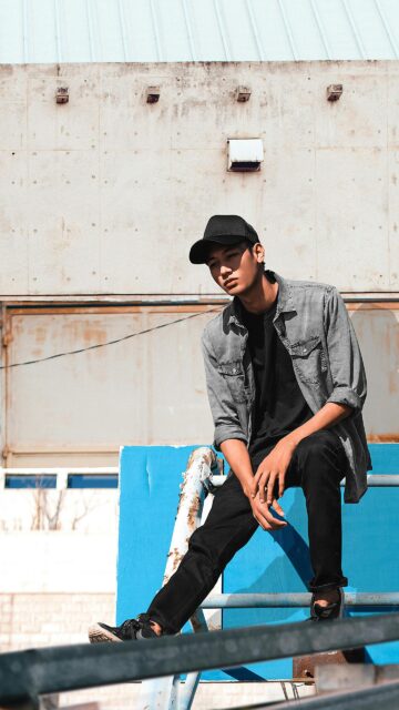 Young Man in Denim Shirt and Cap Urban Style Mobile Wallpaper