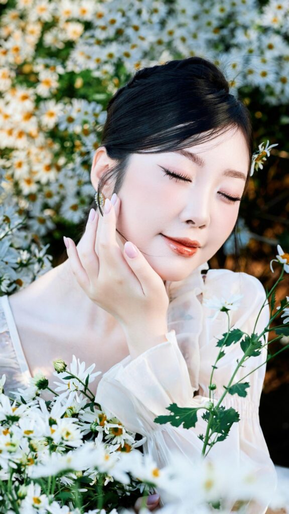 Stunning Portrait of Elegant Woman in Daisy Field Mobile Wallpaper