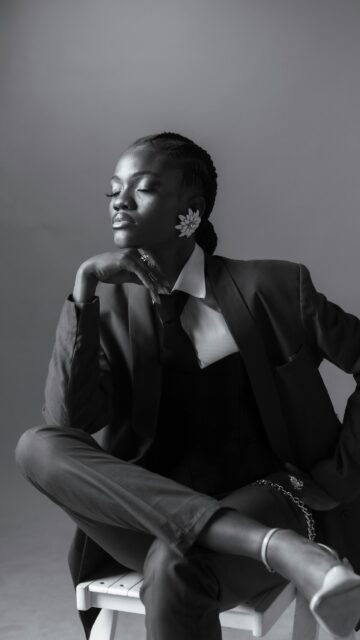 Elegant African Model in Black Suit Fashion Portrait Mobile Wallpaper