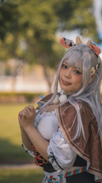 Anime Cosplay Girl with Cute Cow Ears Portrait Mobile Wallpaper