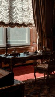 Elegant Victorian Study Room Desk with Golden Sunlight Mobile Wallpaper