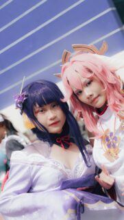 Stunning Raiden Shogun and Yae Miko Genshin Impact Cosplay Wallpaper
