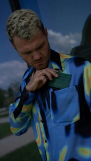 Stylish Man with Green Leather Wallet Aesthetic Mobile Wallpaper