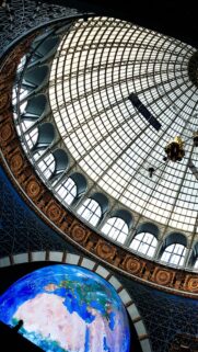 Stunning Cosmonaut Museum Dome with Glowing Earth Map Wallpaper