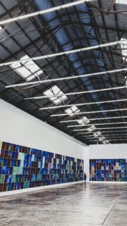 Minimalist Art Gallery Interior with Colorful Grid Artwork Wallpaper
