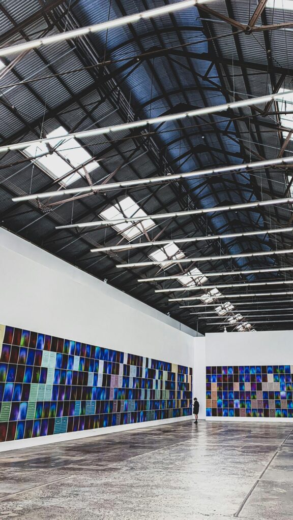 Minimalist Art Gallery Interior with Colorful Grid Artwork Wallpaper