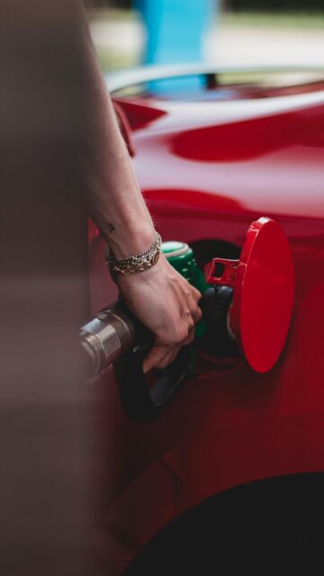 Stunning Red Luxury Car Fueling Aesthetic Mobile Wallpaper