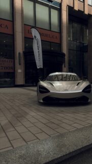 Sleek Silver McLaren Supercar in Montreal City Center Wallpaper