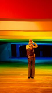 Person Standing in Rainbow Light Tunnel Aesthetic Mobile Wallpaper