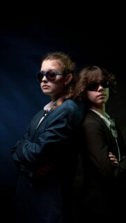 Two Secret Agents in Suits Back to Back Stylish Mobile Wallpaper