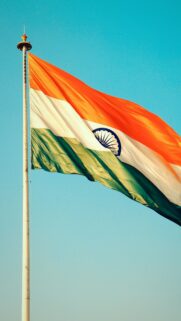Majestic Indian National Flag Waving High in the Sky Mobile Wallpaper