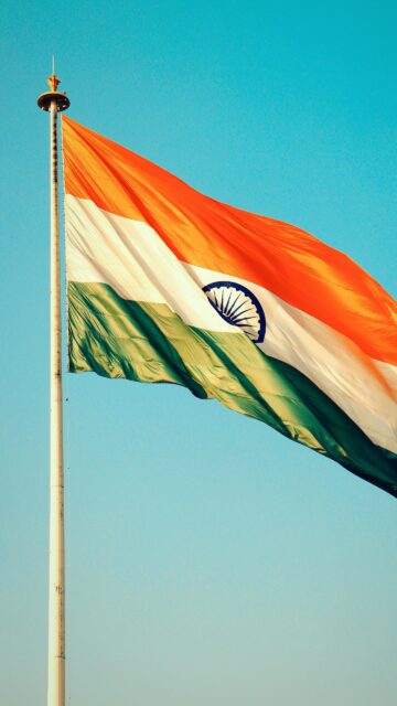 Majestic Indian National Flag Waving High in the Sky Mobile Wallpaper