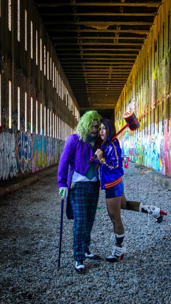 Joker and Harley Quinn Cosplay Couple in Graffiti Tunnel Wallpaper