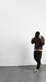 Stylish Man in Streetwear Fashion Minimalist Phone Wallpaper