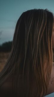 Woman with Natural Long Hair at Sunset Mobile Phone Wallpaper