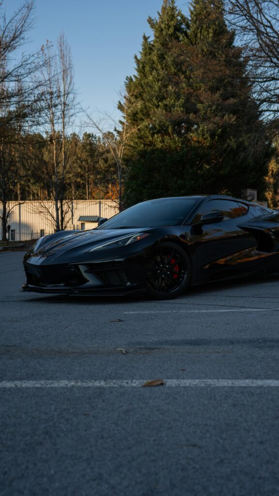 Sleek Black C8 Chevrolet Corvette Sportscar Mobile Wallpaper