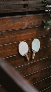 Rustic Ping Pong Paddles on Wood Texture 4K Mobile Wallpaper