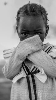 Portrait of a Shy Young Girl in Black and White Mobile Wallpaper