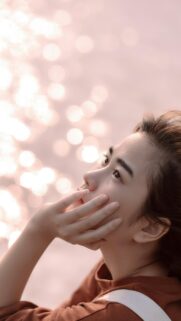 Dreamy Young Woman with Bokeh Sunlight Mobile Phone Wallpaper