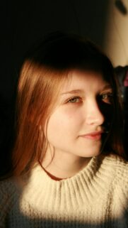 Portrait of a Girl with Golden Sunlight Phone Wallpaper