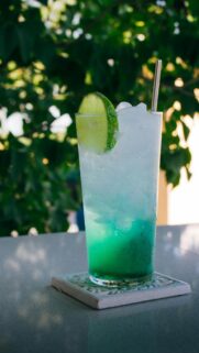 Refreshing Tropical Blue Cocktail with Lime Summer Vibes Phone Wallpaper