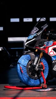 Professional Racing Motorcycle in Pit Garage Mobile Wallpaper