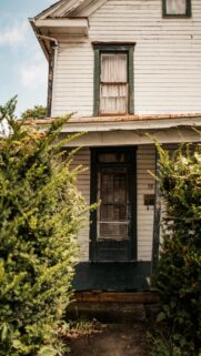 Rustic Abandoned House with Green Trim Mobile Wallpaper