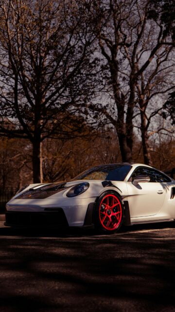 White Porsche 911 GT3 RS with Vibrant Red Wheels Luxury Car Wallpaper