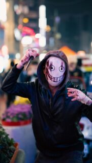 Scary Horror Mask Cosplayer with Knife Dark Aesthetic Mobile Wallpaper