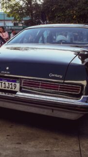 Vintage Buick Century Classic Car Rear View Luxury Aesthetic Wallpaper