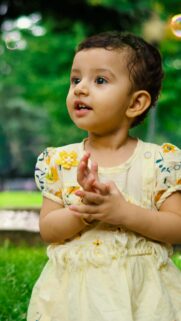 Adorable Indian Baby Girl Playing with Bubbles HD Mobile Wallpaper