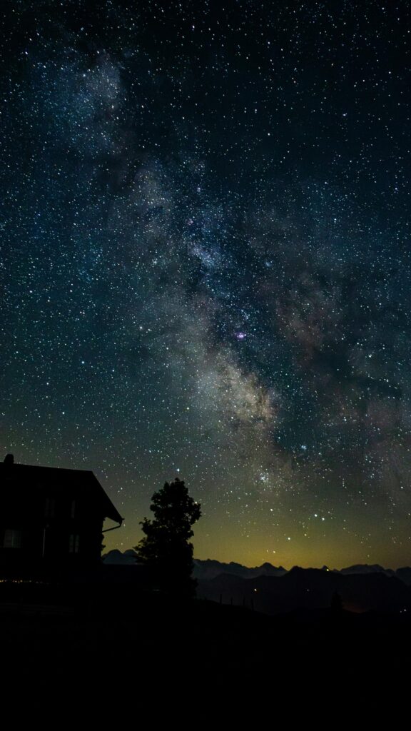 Breathtaking Milky Way Over Mountain House Night Sky Wallpaper