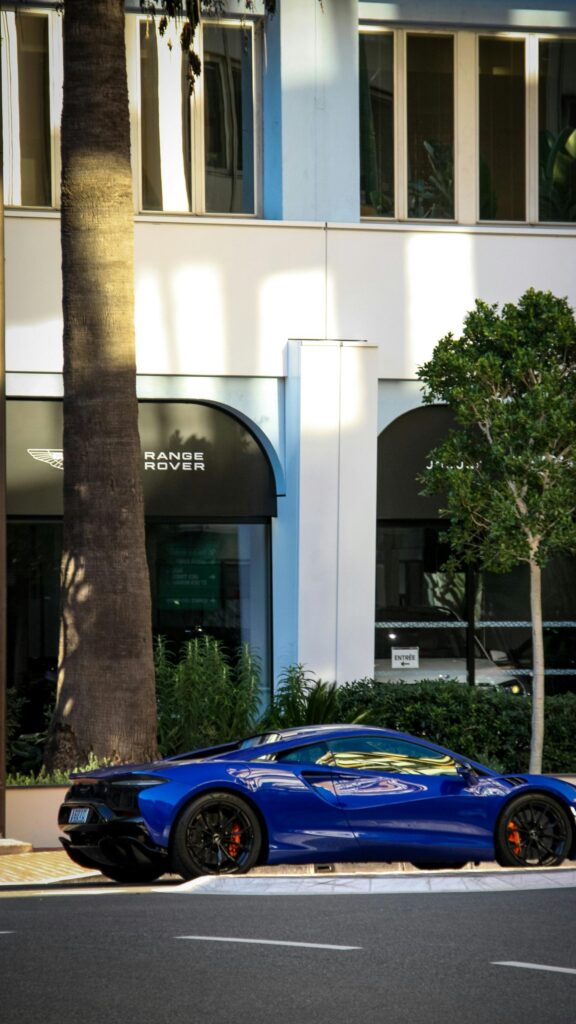 Blue McLaren Artura Supercar Street View Mobile Wallpaper