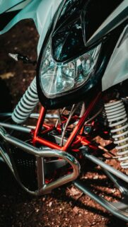 Extreme Red and White All-Terrain Racing ATV Front View Mobile Wallpaper